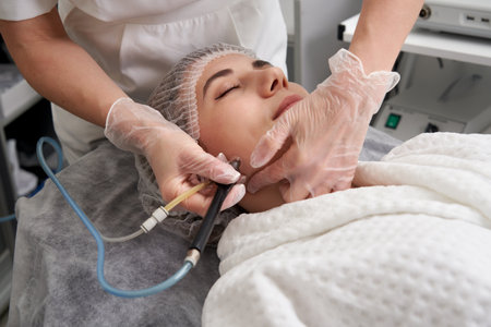 Woman Getting Facial Hydro Microdermabrasion Peeling Treatment At Cosmetic Beauty Spa Clinic. Hydra Vacuum Cleanerの写真素材