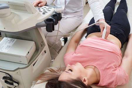 Gynecologist doing ultrasound scan in modern clinic