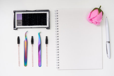 Set of eyelash instruments with notepad and copyspaceの写真素材