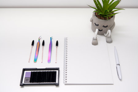 Set of eyelash instruments with notepad and copyspaceの写真素材