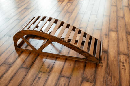 Yoga wooden Backbend Bench in studio for doing Stretching Exercises