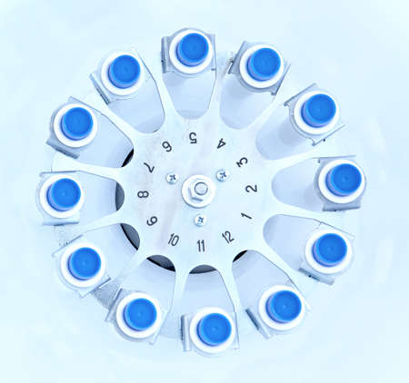 Blood centrifuge. Platelet-Rich plasma preparation. Tubes with blood in Centrifuge. Blue tonned imageの写真素材