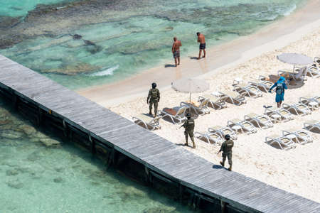 Cancun, Mexico - September 15, 2021. Marina soldiers of Mexican army patrolling beach in Cancun