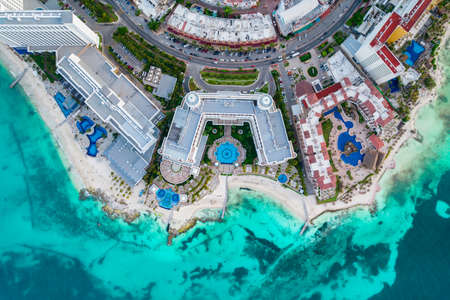 Aerial panoramic view of Cancun city hotel zone in Mexico. Caribbean coast landscape of Mexican resort with beach Playa Caracol and Kukulcan road. Riviera Maya in Quintana roo region on Yucatan Peninsulaの写真素材