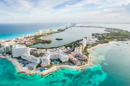 Aerial panoramic view of Cancun city hotel zone in Mexico. Caribbean coast landscape of Mexican resort with beach Playa Caracol and Kukulcan road. Riviera Maya in Quintana roo region on Yucatan Peninsulaの写真素材