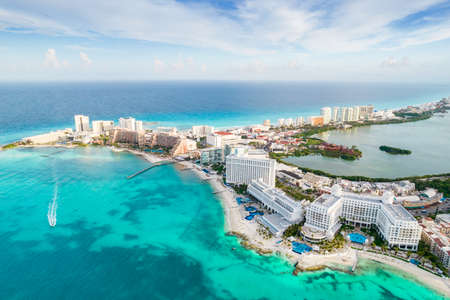 Aerial panoramic view of Cancun city hotel zone in Mexico. Caribbean coast landscape of Mexican resort with beach Playa Caracol and Kukulcan road. Riviera Maya in Quintana roo region on Yucatan Peninsulaの写真素材