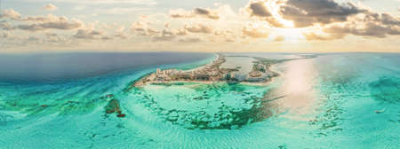 Aerial 360 panoramic view of Cancun beach and city hotel zone in Mexico at sunset. Caribbean coast landscape of Mexican resort with beach Playa Caracol and Kukulcan roadの写真素材