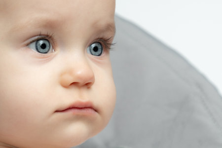 Close up of a baby face with blue eyes