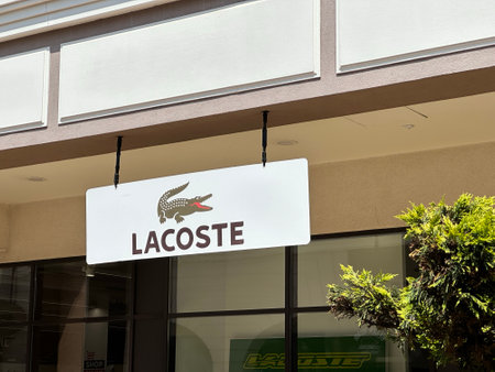 Belgrade, Serbia - June 16, 2024: Lacoste Storefront Logo and Signage with iconic Crocodile Emblem, symbolizing luxury and fashionのeditorial素材