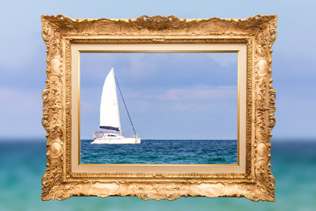 Sailing white yacht and blue water ocean in golden vintage frameの写真素材