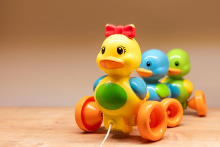 Colorful Pull Toy Duck accompanied by adorable two little ducks on a shelf for playful fun and joy