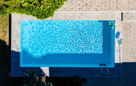 Top view of swimming pool and luxury villaの写真素材