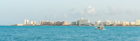 Cancun skyline view across turquoise waters on a sunny day. Concept of tropical paradise vacationsの写真素材