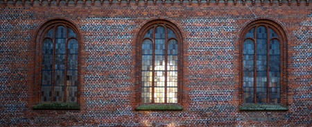 brick wall with windowsの写真素材