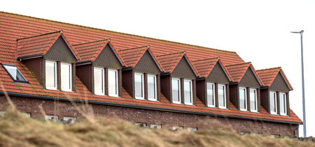 the roof of the house with nice windowの写真素材