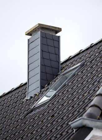 Roof with chimney, modern ceramic tileの写真素材
