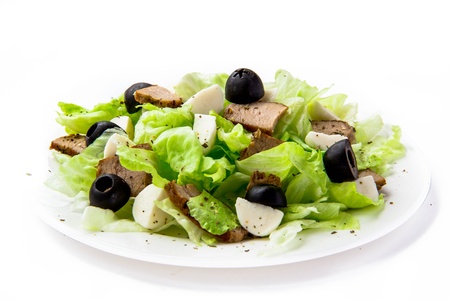 Fresh salad with lettuce, meat and olives の写真素材