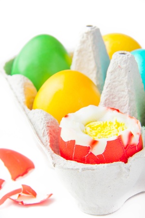 colored painted eggs in a basket の写真素材