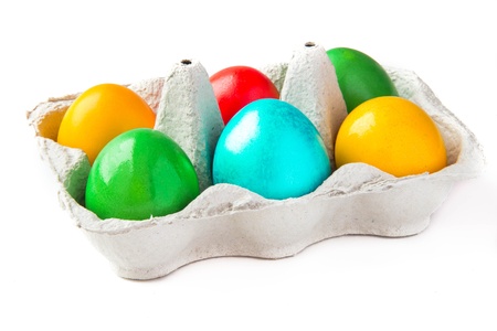colored painted eggs in a basket の写真素材