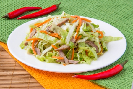 Crispy salad with pork, korean carrots and lettuce の写真素材