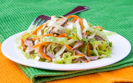 Crispy salad with pork, korean carrots and lettuce の写真素材