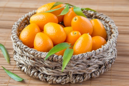 Fortunella in wicker basket の写真素材