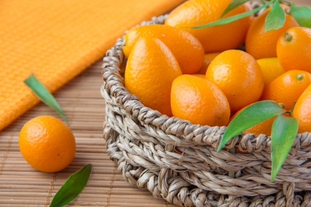 Fortunella in wicker basket の写真素材