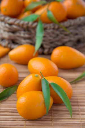 Fortunella in wicker basket の写真素材