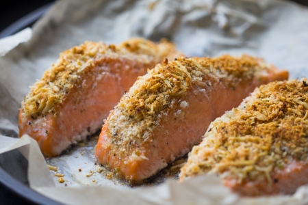 Steak fillet of red fish salmon with cheese crust breading in baked form