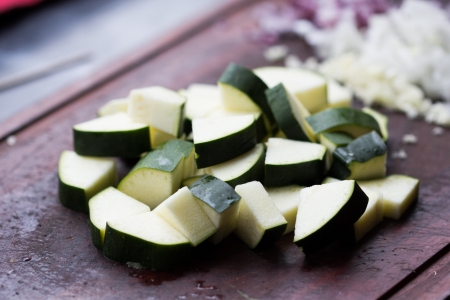Cut into triangles fresh zucchini, cooking homemade dinnerの写真素材
