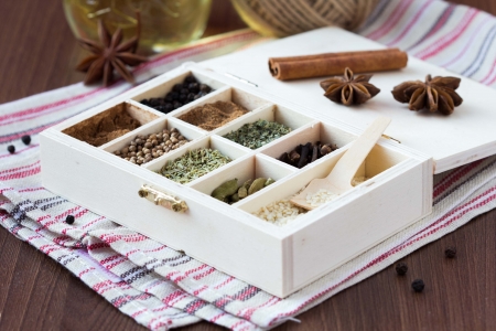Assortment collection of spices and herb in wooden box, food backgroundの写真素材