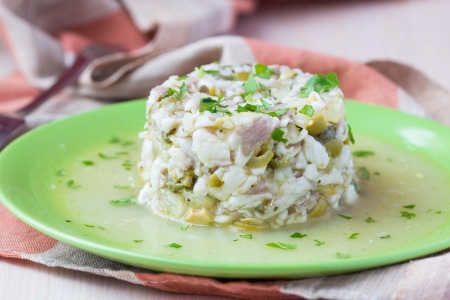 Tartar ceviche of raw white fish with olives, lemon, sauce, capers, onions, parsley, gourmet...
