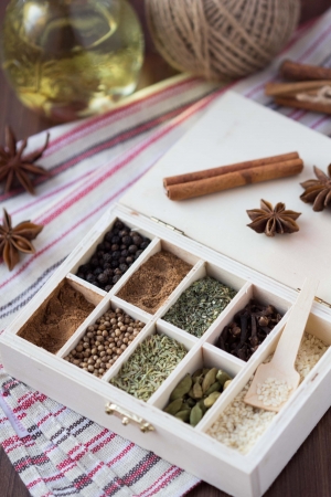 Assortment collection of spices and herb in wooden box, food backgroundの写真素材
