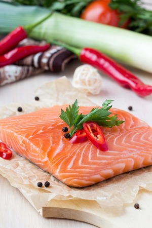 Raw fillets of red fish, salmon, cooking healthy diet dishes for dinnerの写真素材