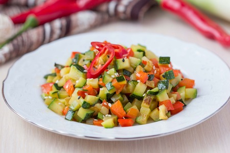 Fried vegetables cubes, Ratatouille, zucchini, red pepper, delicious vegetarian dinnerの写真素材