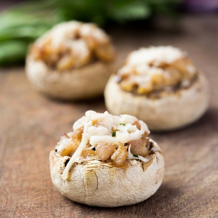 Mushroom champignons stuffed with filling of chicken, cheese, delicious appetizerの写真素材