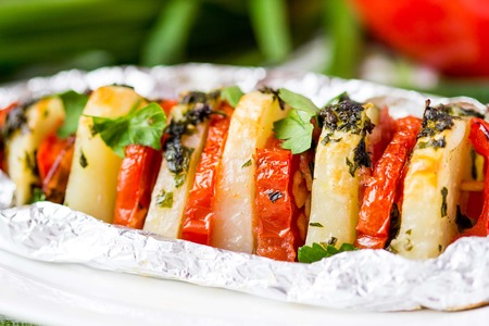 Potato vegetarian kebab, skewer with vegetables, tomato, herb on stick, tasty picnic dishの写真素材