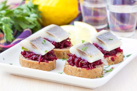 Canape herring with beets on rye toast, Russian appetizer for vodkaの写真素材