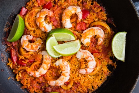 Spanish dish paella with seafood, shrimps, squid, rice, saffron, traditional tasty dinnerの写真素材