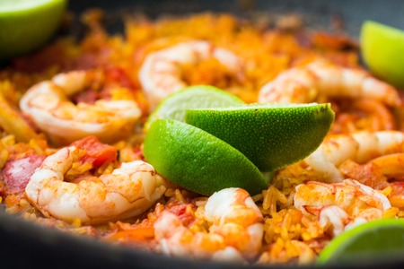 Spanish dish paella with seafood, shrimps, squid, rice, saffron, traditional tasty dinnerの写真素材