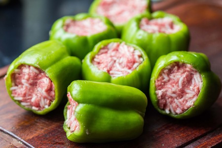 Green peppers, prepared for cooking stuffed paprika with raw meat and rice, homemade dishの写真素材