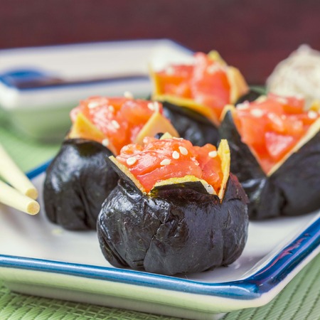 Sushi roll with rice, red fish, salmon, nori, beautiful ballの写真素材