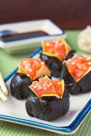 Sushi roll with rice, red fish, salmon, nori, beautiful ballの写真素材