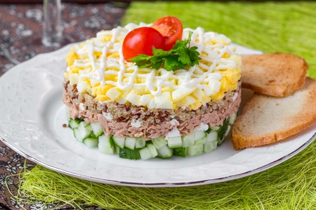 Russian salad with tuna, quinoa, egg, cucumber, stack, holiday appetizer, tasty dishの写真素材