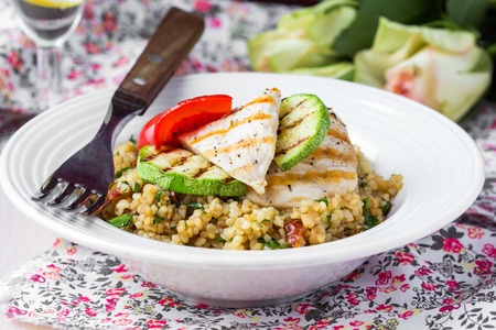 Bulgur with vegetables and grilled chicken, healthy, diet tasty summer dishの写真素材