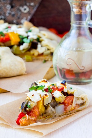 Vegetable pie with eggplant, zucchini, peppers, feta cheese, parsley, Greek dishの写真素材