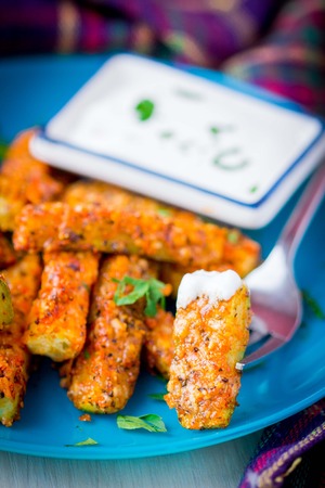 Fried cheese breaded zucchini with sour cream, spring, summer, tastyの写真素材