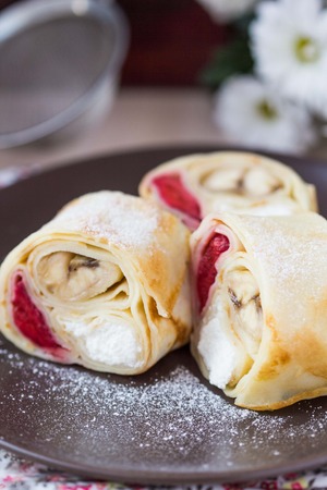 Tasty pancake rolls with three toppings, cheese, strawberries, banana, Shrovetideの写真素材