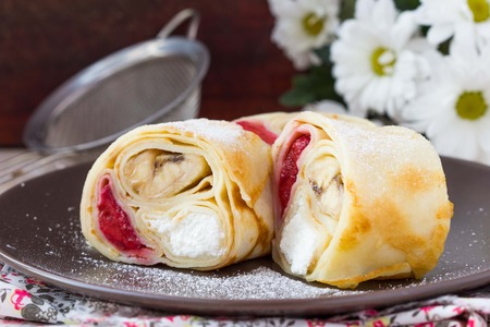 Tasty pancake rolls with three toppings, cheese, strawberries, banana, Shrovetideの写真素材