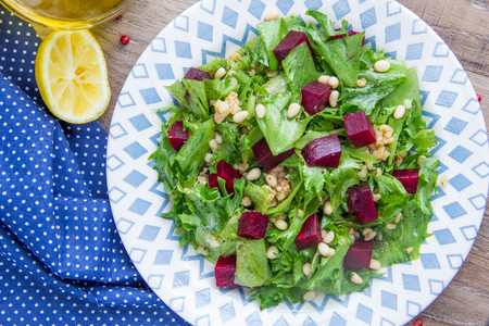Fresh salad with beets, lettuce, pine nuts, bulgur, vegetarian summer dishの写真素材